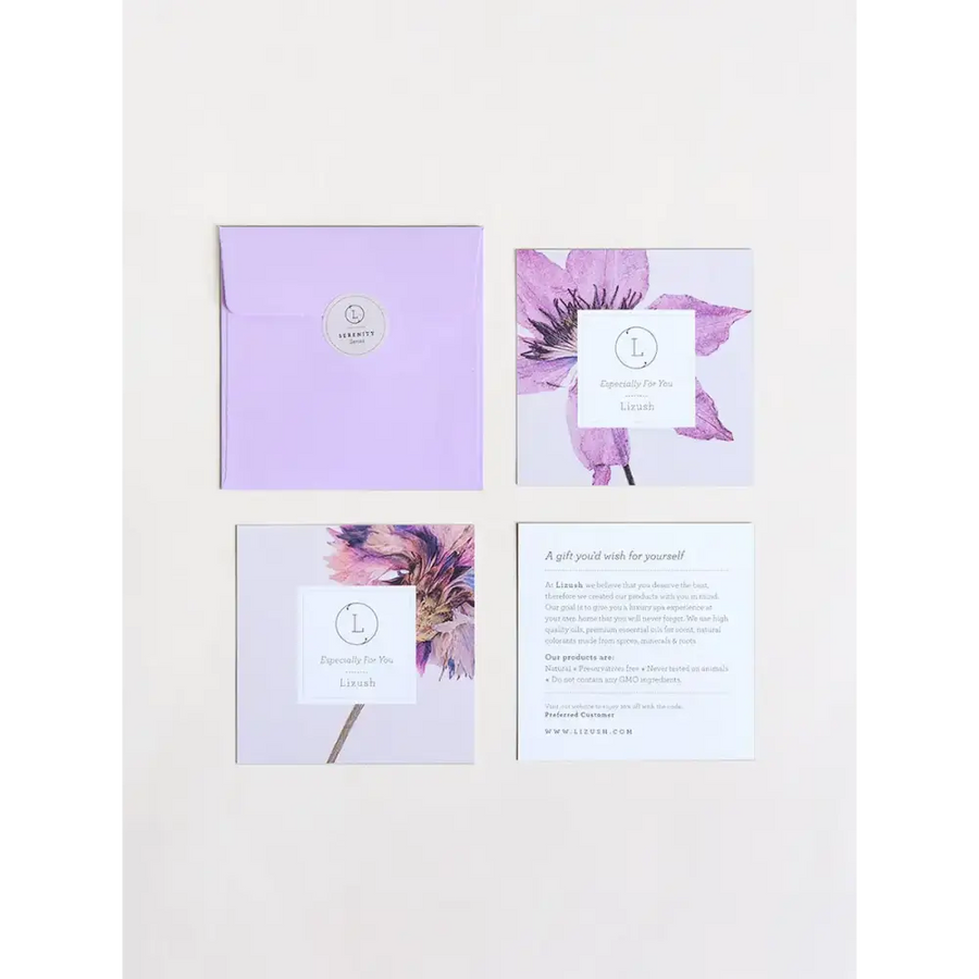 Lavender envelope with circular silver logo seal