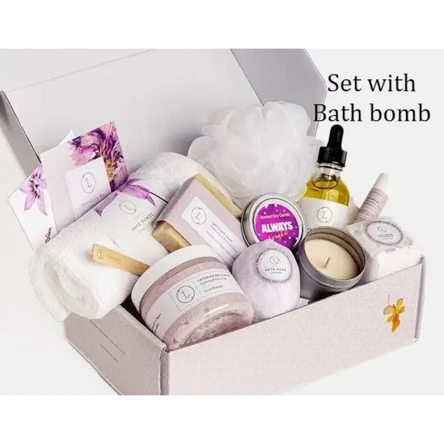 A lavender-scented bath bomb nestled among other spa items in a gift box.