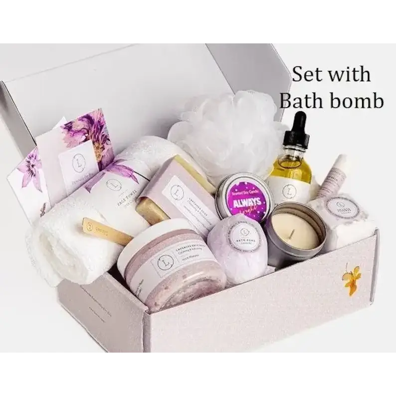 A lavender-scented bath bomb nestled among other spa items in a gift box.
