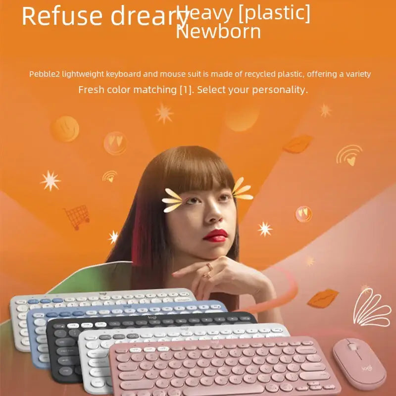 Pebble2 lightweight keyboard and mouse set in pastel pink recycled plastic with matching wireless mouse.