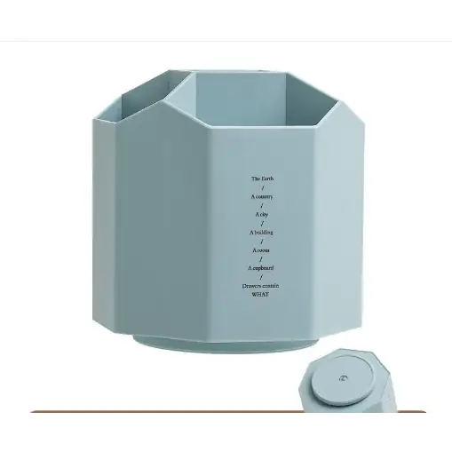 Light blue octagonal organizer with a matching lid, featuring engraved text on its side.