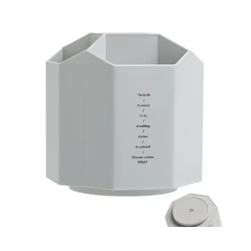 White octagonal desk organizer with a minimalist design and engraved text on its side.