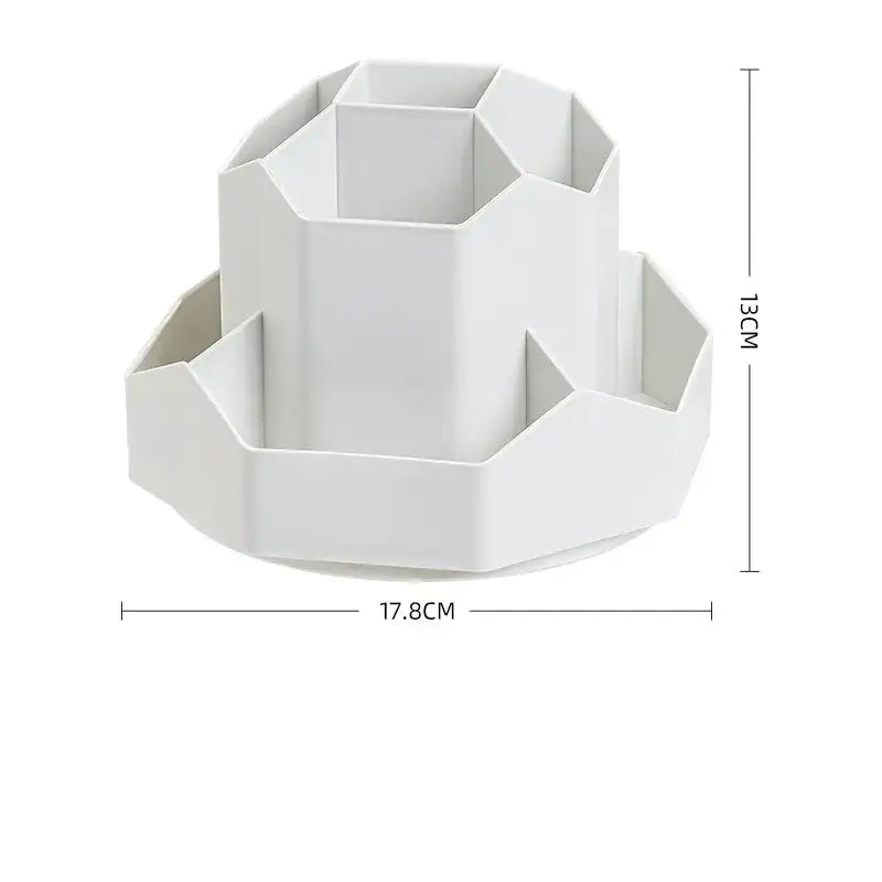White geometric desk organizer with multiple compartments and a circular base.