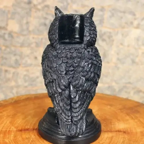 Black owl-shaped candle holder with detailed feather texture and a smooth, glossy finish.