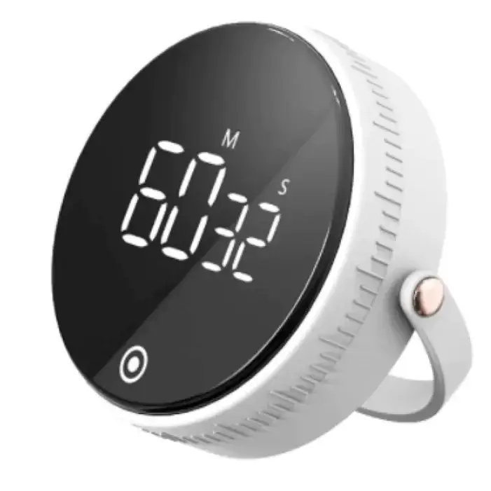 White circular digital timer with a black display showing ’01:22’’ and marked minutes (m) and seconds (s), featuring a textured bezel, a small rose-gold button on the side, and an integrated handle.