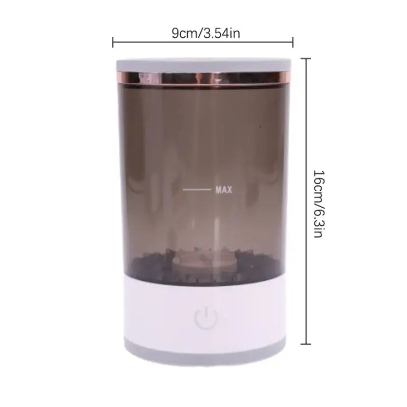 A sleek, cylindrical humidifier with a translucent brown body and white base, accented by a rose gold rim.
