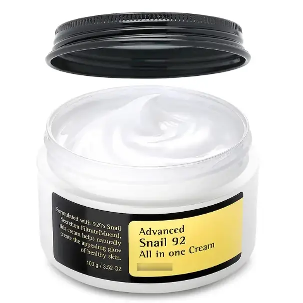 White jar with black lid and yellow label containing advanced snail 92 all in one cream.