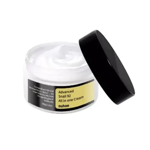 White jar with black lid containing a creamy white substance, labeled ’advanced snail 92 all in one cream’ by the brand ouhoo.