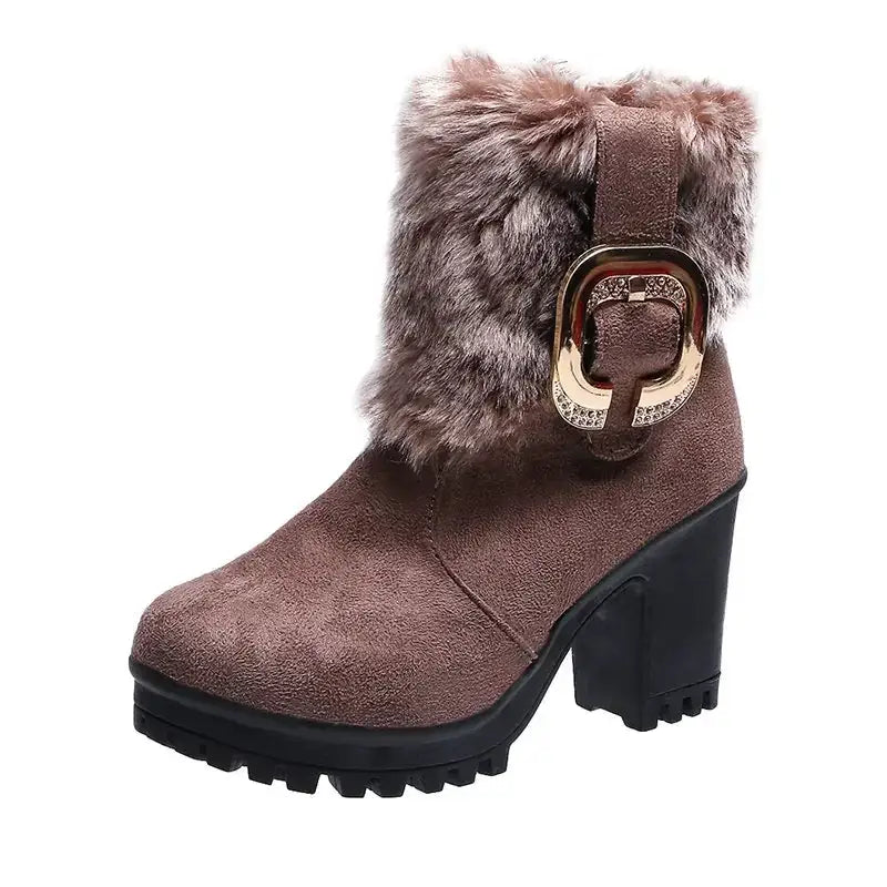 Brown suede ankle boot with faux fur trim and a gold-toned buckle adorned with rhinestones.