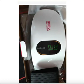 White northern brand slimming belt with a digital display showing battery level and settings.