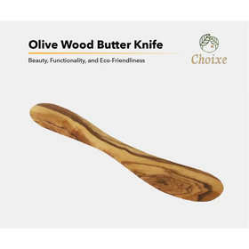 A smooth, handcrafted olive wood butter knife with a natural grain pattern and warm brown tones.