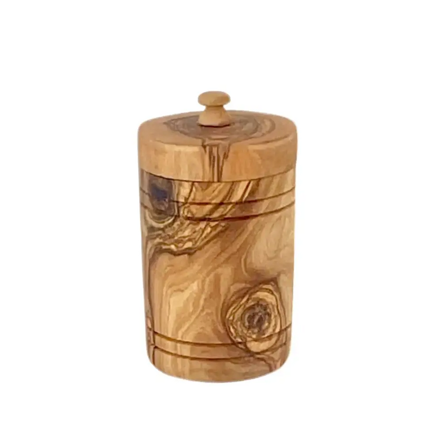 A cylindrical olive wood jar with a natural, light brown finish and visible grain patterns, featuring a matching lid topped by a small rounded knob.