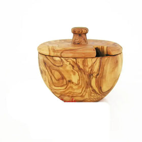 Handcrafted olive wood sugar bowl with a natural, swirling grain pattern and a small knob handle on the lid.