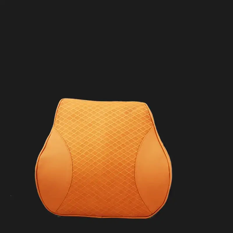 Orange quilted car neck pillow with a diamond pattern and contoured shape.
