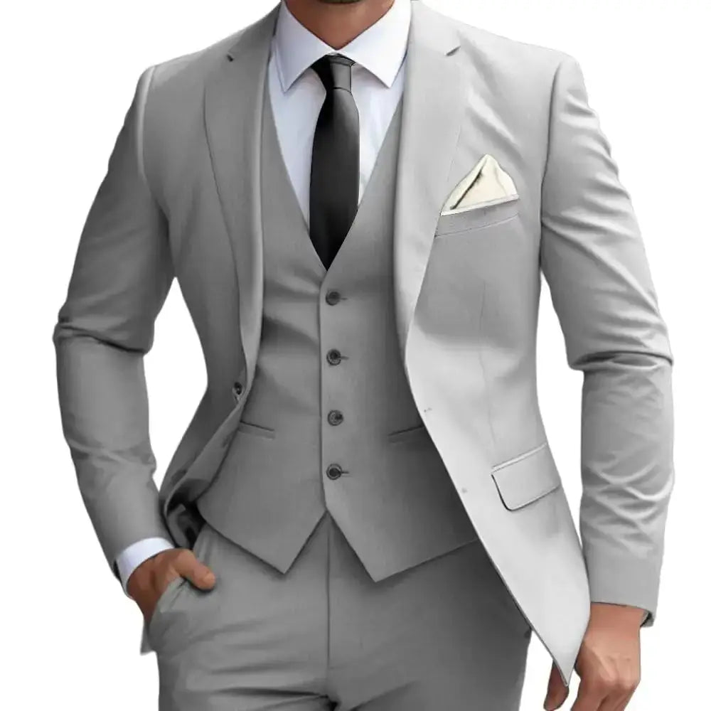 A sleek, light gray three-piece suit with a tailored fit and subtle texture.