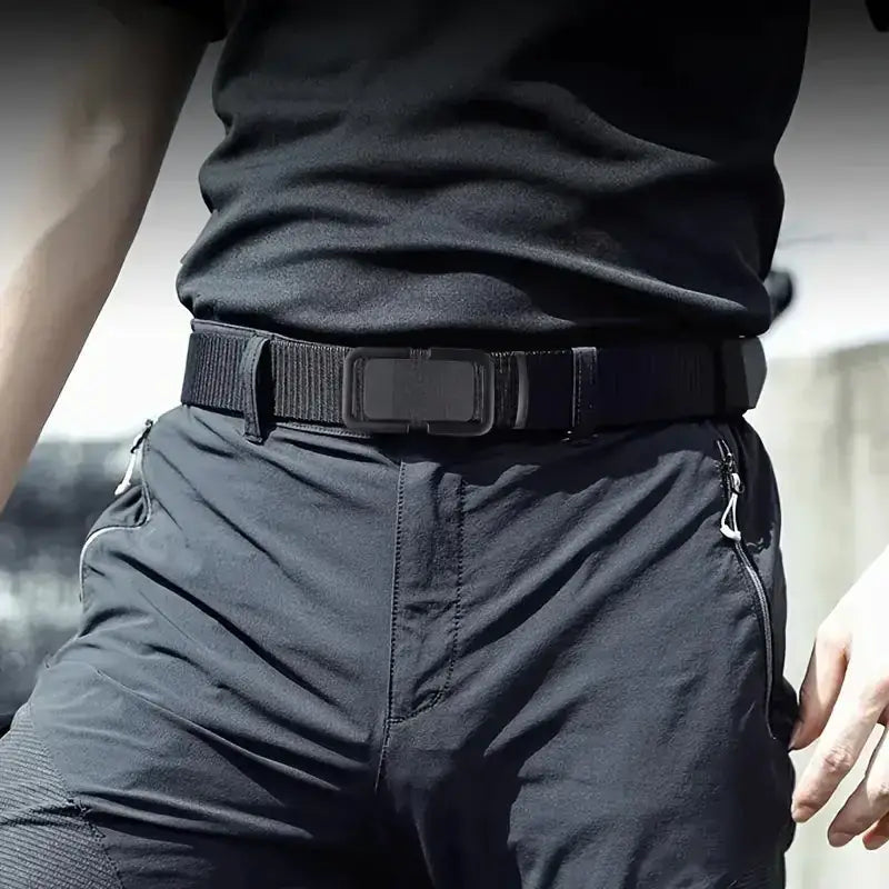 Black tactical belt with a matte black plastic buckle and reinforced stitching.