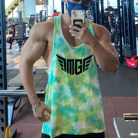Vibrant green and yellow tie-dye tank top with bold black ’amge’ logo across the chest.