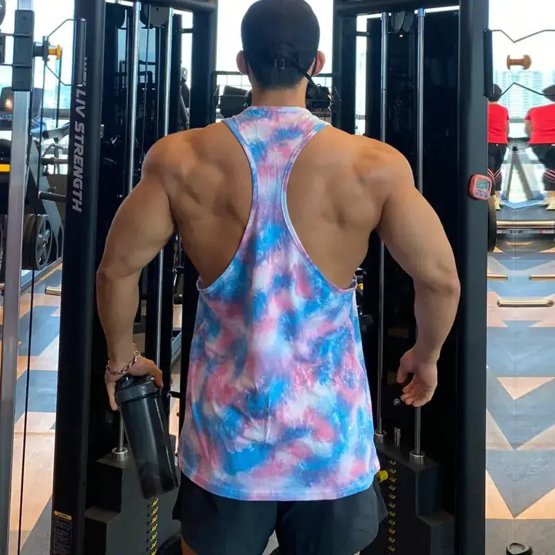 A vibrant tie-dye tank top in swirling shades of blue, pink, and white.