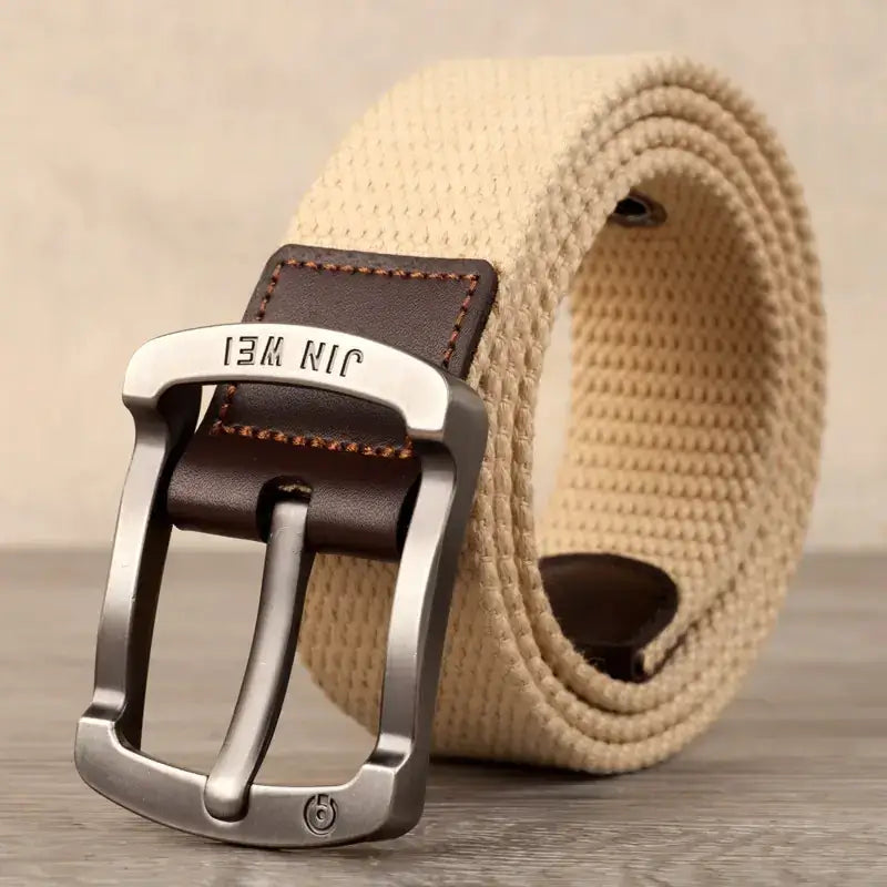 Beige woven canvas belt with a silver-toned metal buckle and dark brown leather accents.