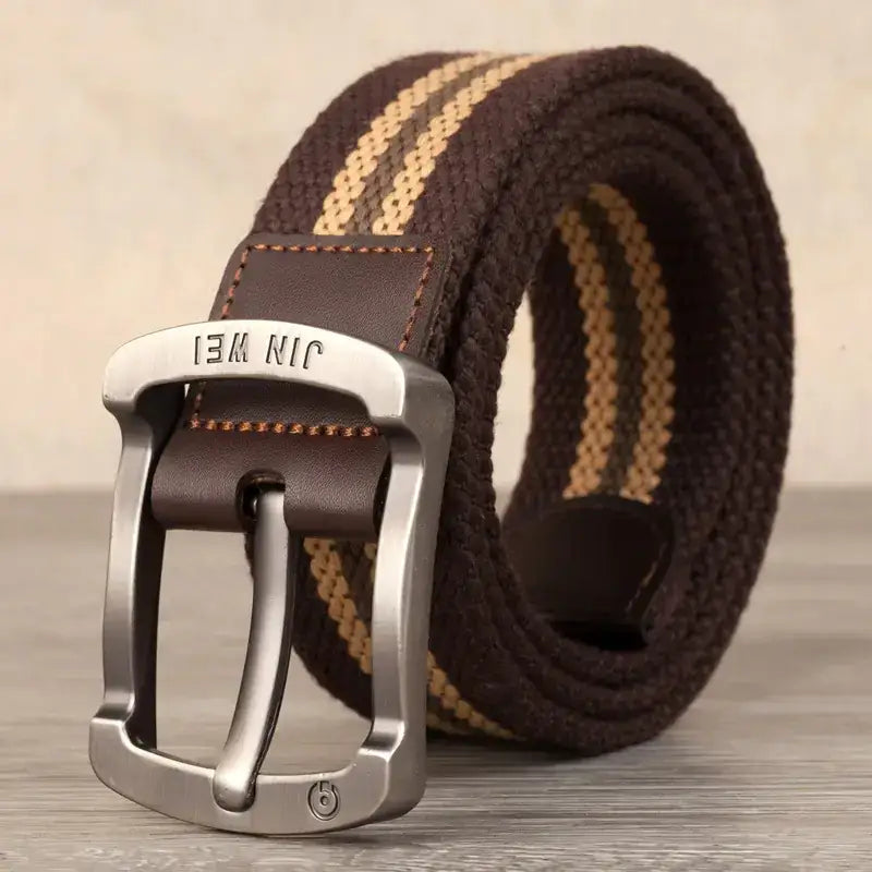Brown and tan striped canvas belt with a silver-toned metal buckle featuring the brand name ’jin wei’ engraved on it.