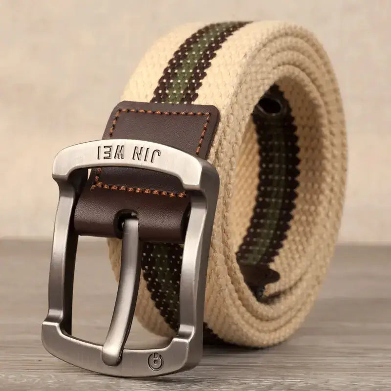 Beige and olive green woven canvas belt with a silver-toned metal buckle featuring the brand name ’jin wei’ engraved on it.