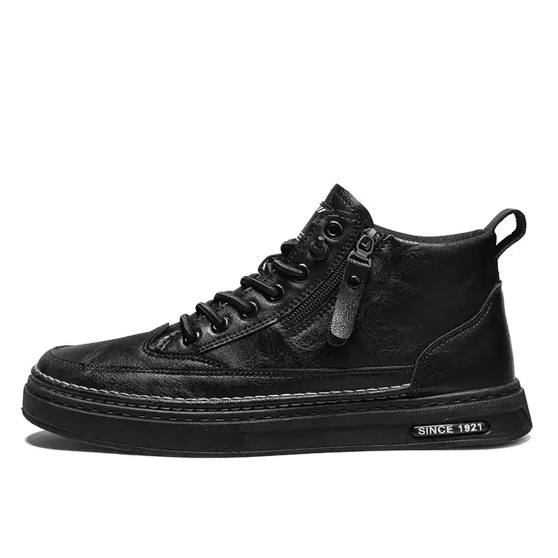 Black leather high-top sneaker with a zipper on the side and white stitching along the sole.