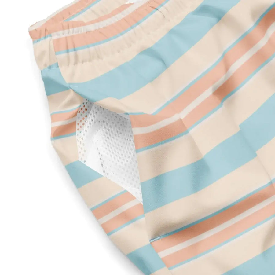 Pastel striped swim trunks in soft peach and light blue horizontal stripes with a mesh lining.