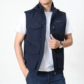 Navy blue hooded utility vest with multiple pockets and a zipper closure