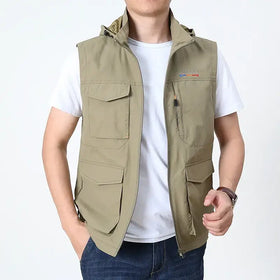 Khaki-colored, multi-pocket outdoor vest with a hood and zipper closure