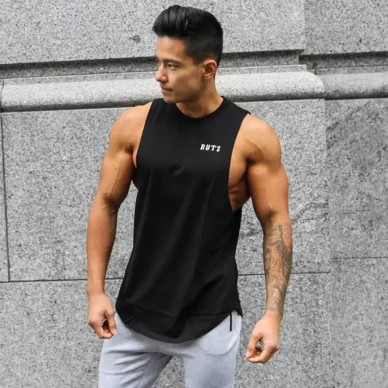 Black sleeveless athletic tank top with a subtle white ’butz’ logo on the chest.