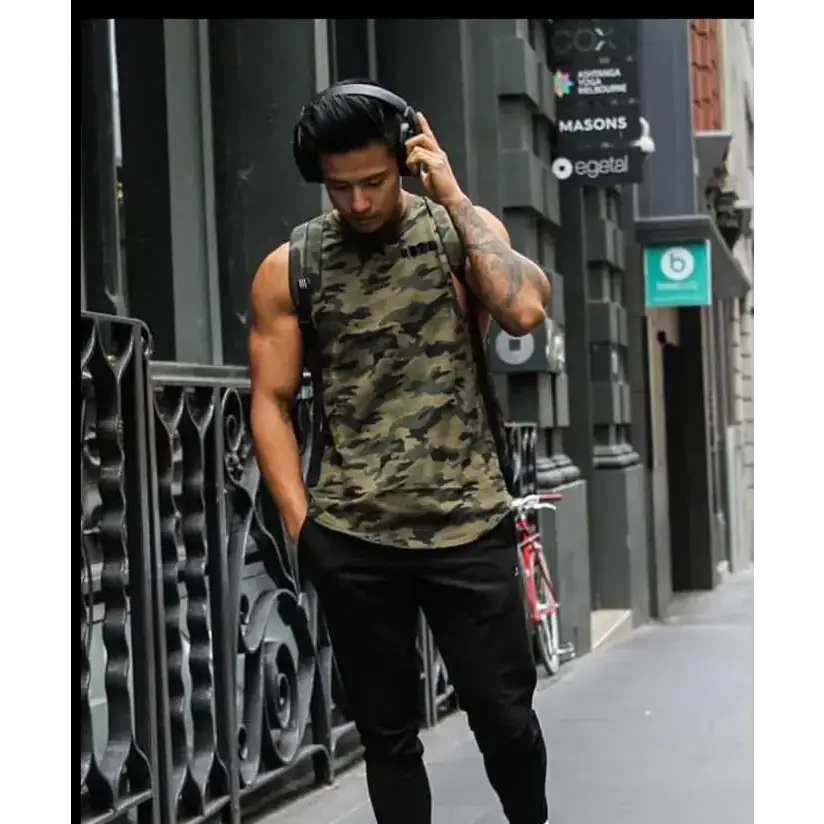 Black over-ear headphones with a padded headband and earcups, worn by the man.