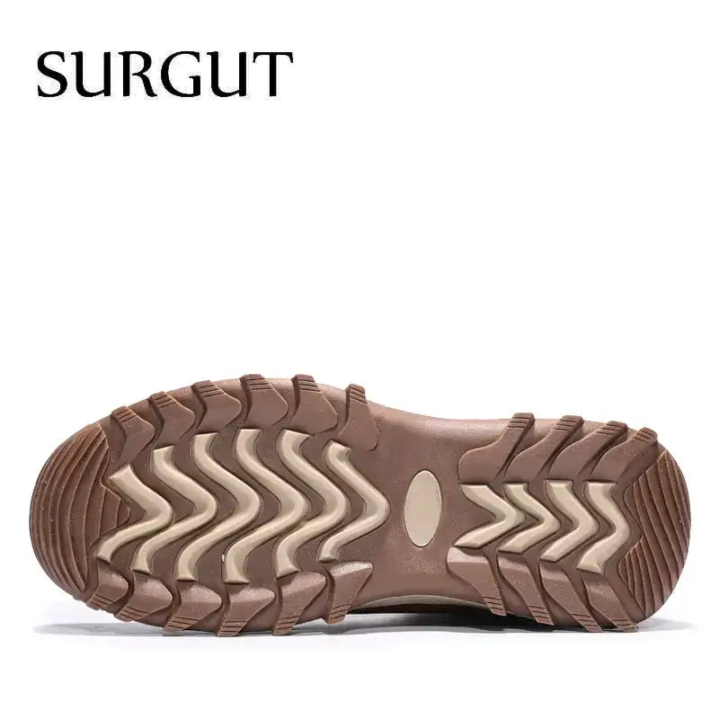 Brown and beige rubber sole with a rugged, wavy tread pattern.