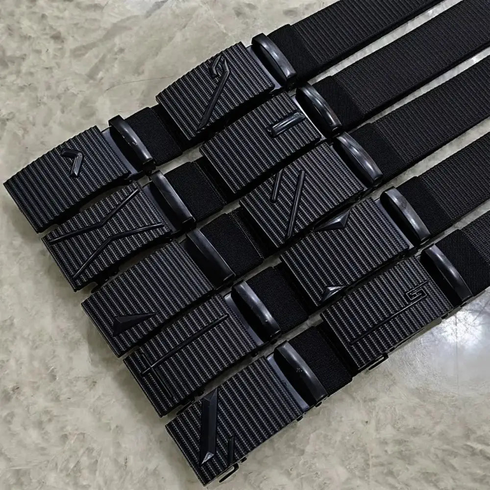 Black tactical webbing belts with matte-finish plastic buckles featuring embossed geometric logos.