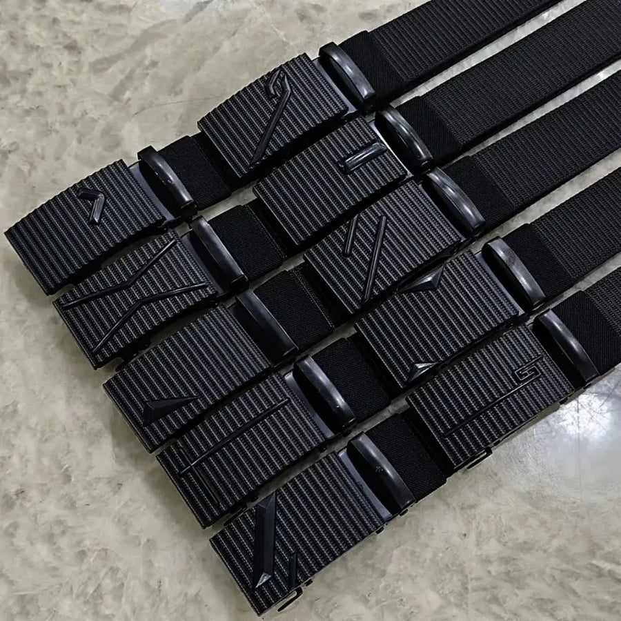 Black tactical webbing belts with matte-finish plastic buckles featuring embossed geometric logos.