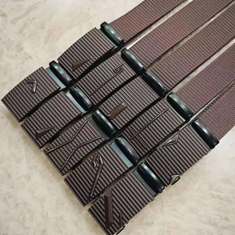 Brown woven belt with black plastic buckle featuring embossed geometric designs.