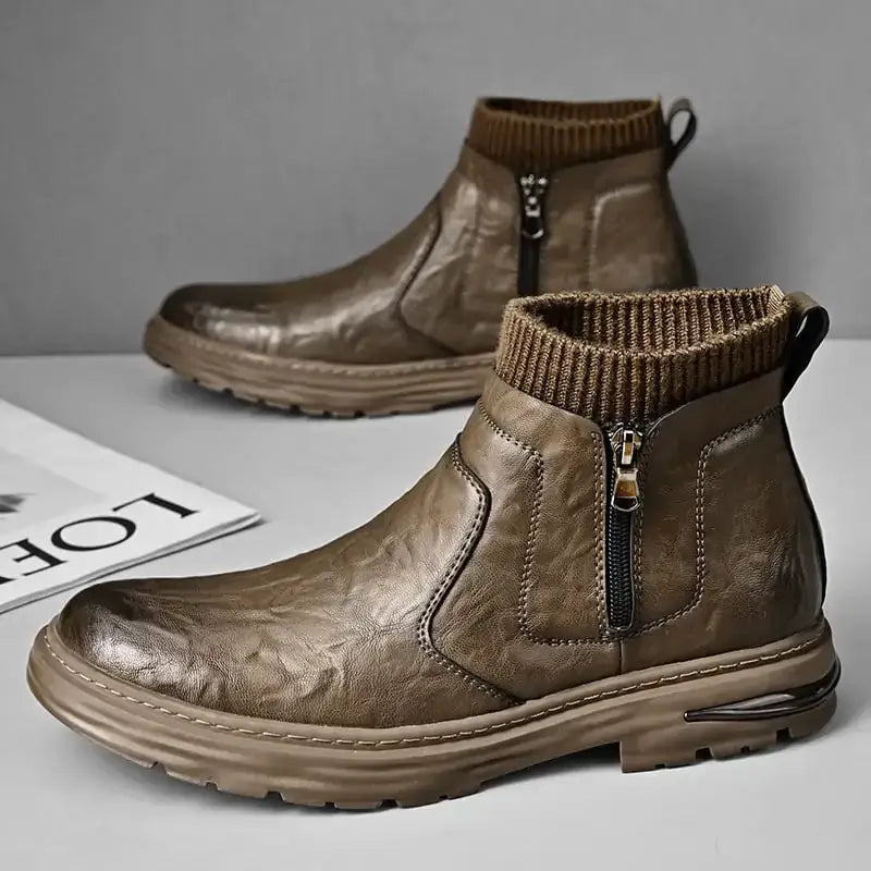 Brown leather ankle boots with a ribbed knit cuff and side zipper.