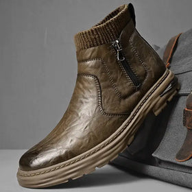 Brown leather ankle boot with a knitted collar and black zipper.