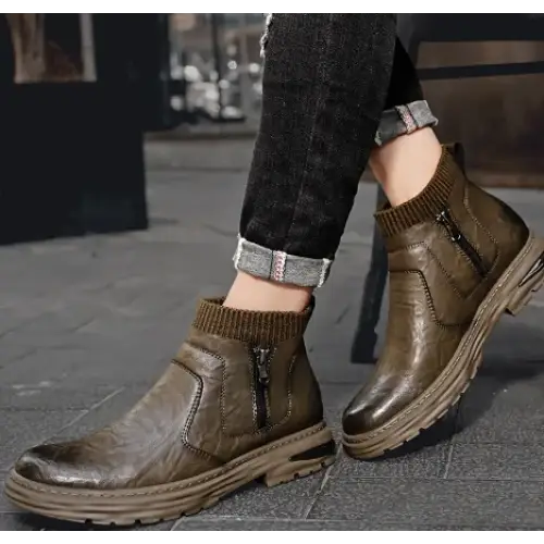 Olive green leather ankle boots with a ribbed knit cuff and zipper detail