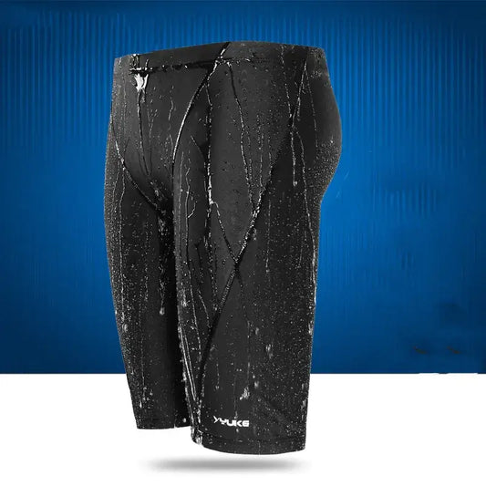 Black yuke swim trunks with a sleek, form-fitting design and subtle white branding at the bottom.