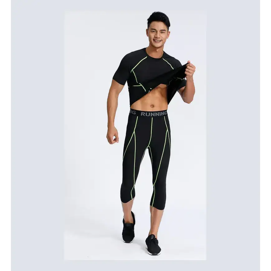 Black athletic top with neon green stitching and matching capri leggings, both featuring a sleek, form-fitting design.