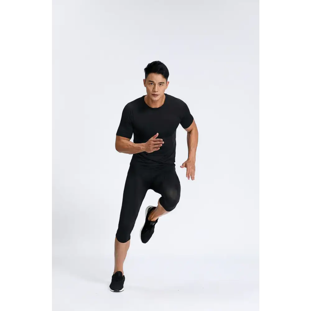 Black athletic short-sleeve top with a crew neckline and form-fitting design.