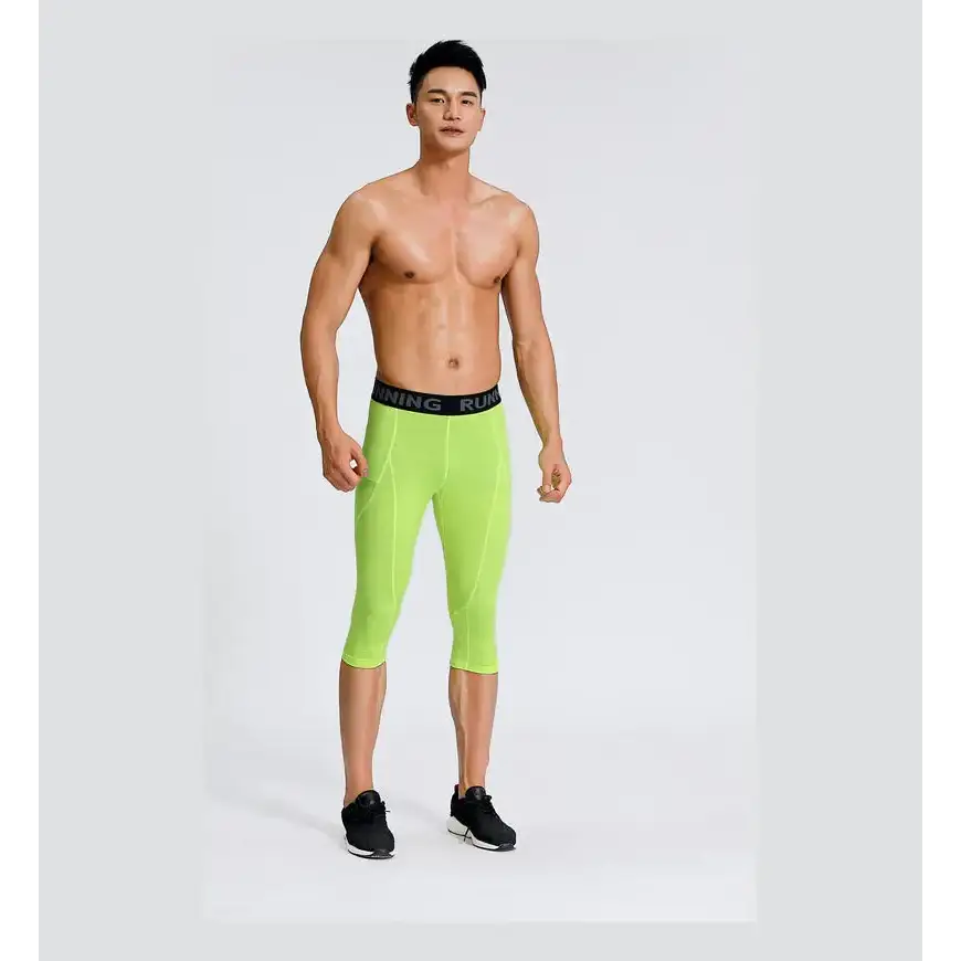 Bright neon green capri-length running tights with a black waistband featuring the word ’running’ in white lettering.