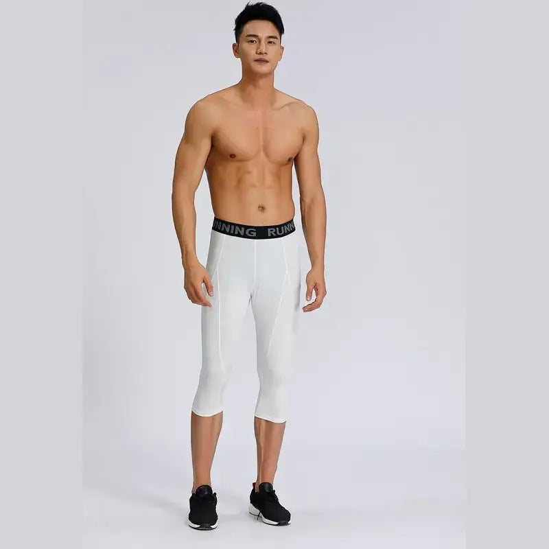 White capri-length running tights with a black waistband featuring the word ’running’ in white lettering.