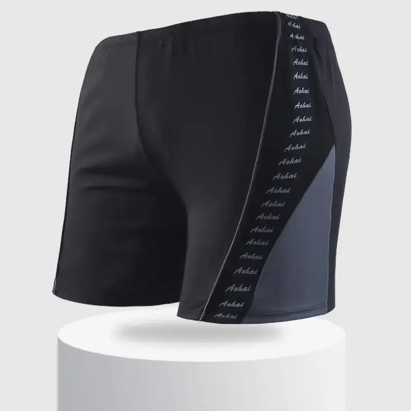 Black athletic shorts with a vertical stripe of repeating ’aohai’ text along the side seam.