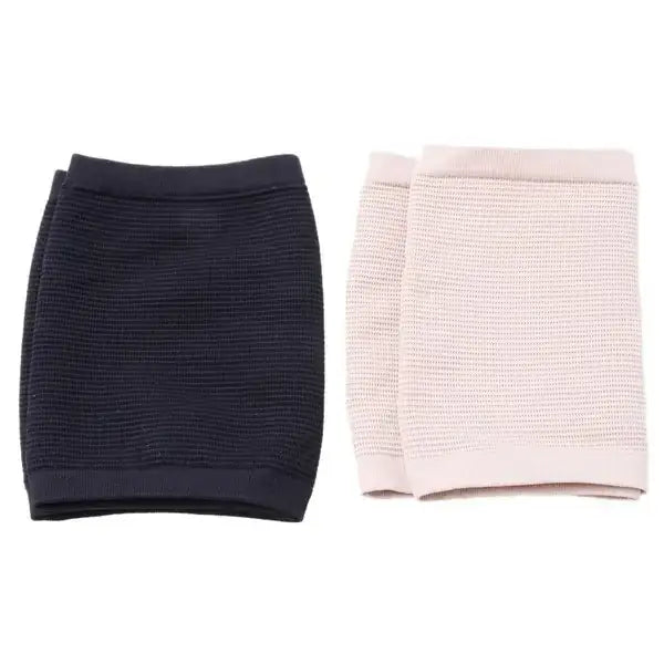 A pair of knitted compression sleeve cuffs, one in solid black and the other in soft blush pink.