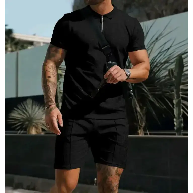 Black textured polo shirt with a zipper collar and short sleeves.