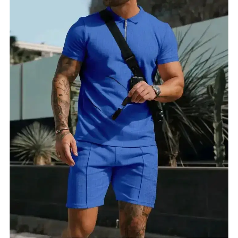Blue textured polo shirt with short sleeves and a zipper collar.