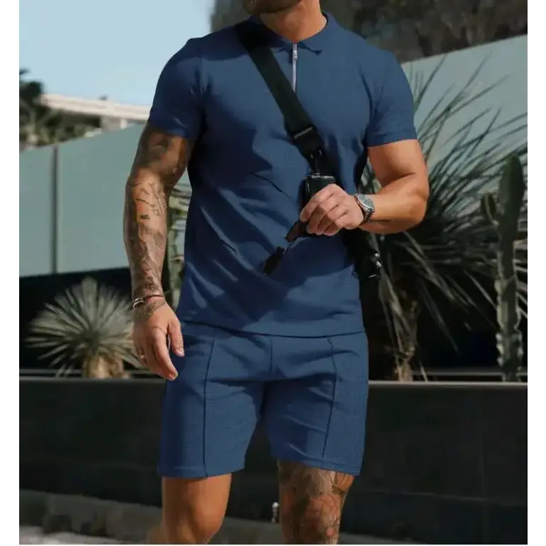 Blue short-sleeved polo shirt with a collar and zipper placket.
