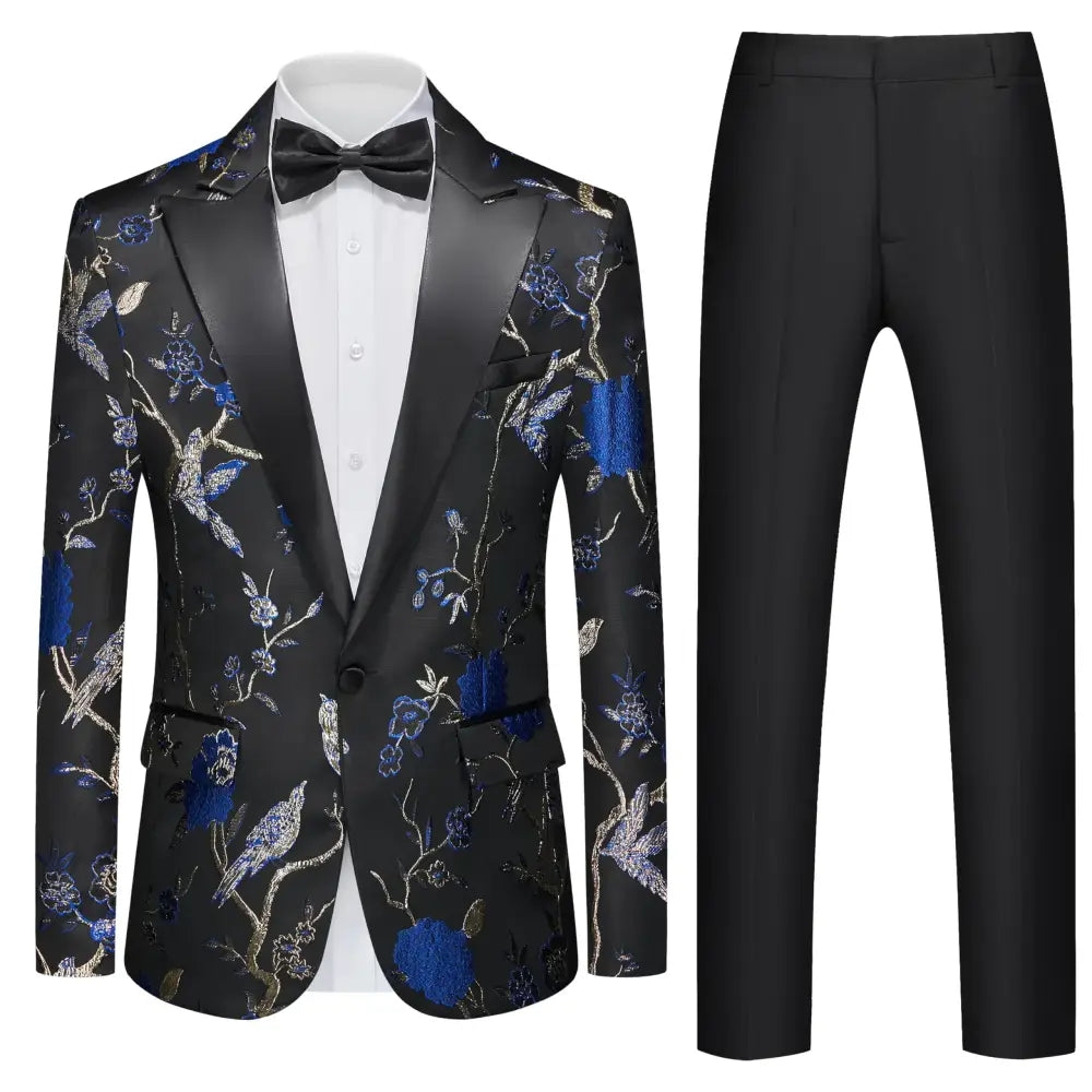Black tuxedo jacket with intricate blue and gold floral embroidery featuring birds, paired with matching black trousers.