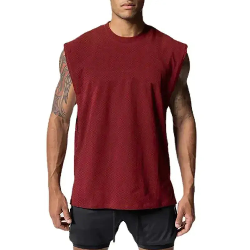 A maroon sleeveless athletic top with a textured, breathable fabric and a relaxed fit.
